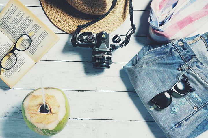 vacation stuff-jeans, sun glass, hat,camera,glass,scarf and coconut water