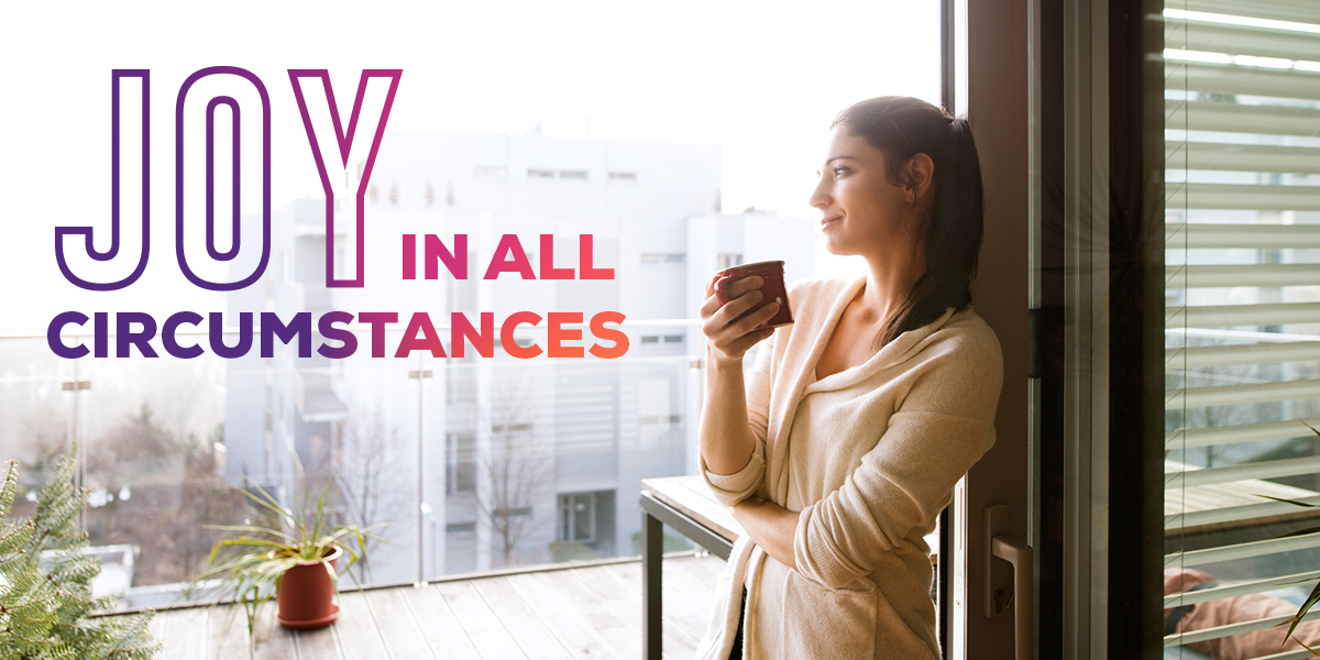 Woman staring out a window. "Joy in all Circumstances"