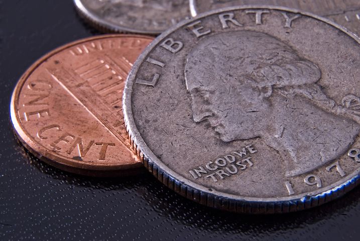close up image of pennies and quarters
