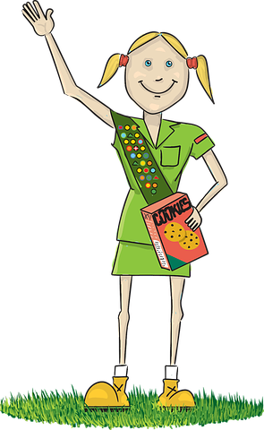 Girl Scout holding cookies box