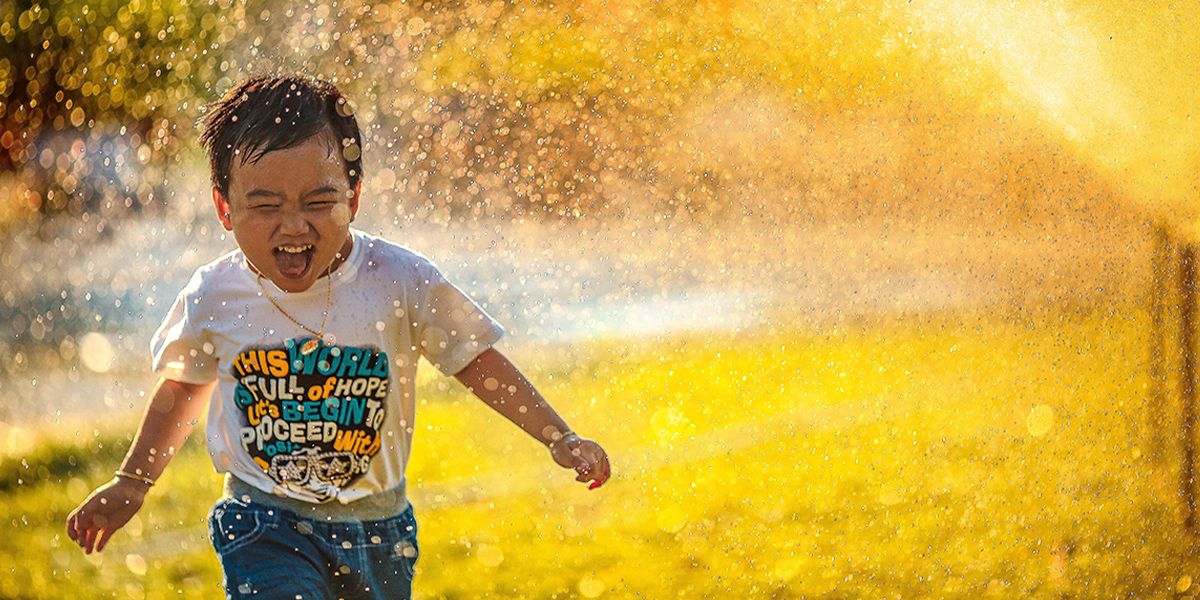 kid playing in sprinkles