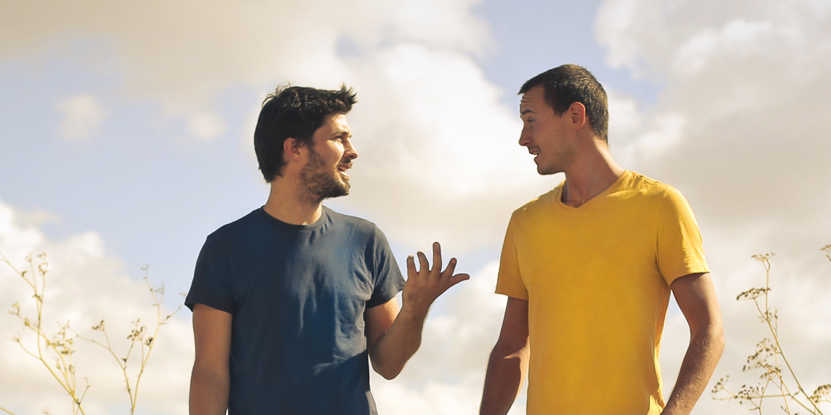 Two guys talking outdoor