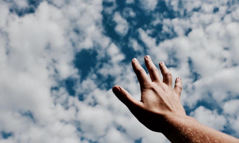 hand reaching up to sky jesus god