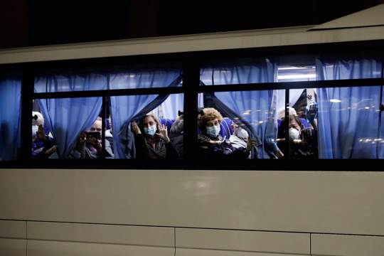 Buses carrying passengers from the quarantined Diamond Princess cruise ship