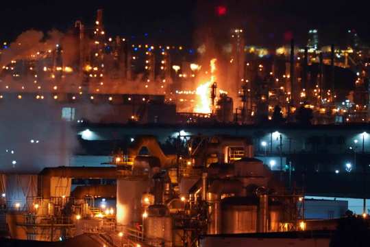 A fire burns after an explosion at the Marathon Refinery in Carson