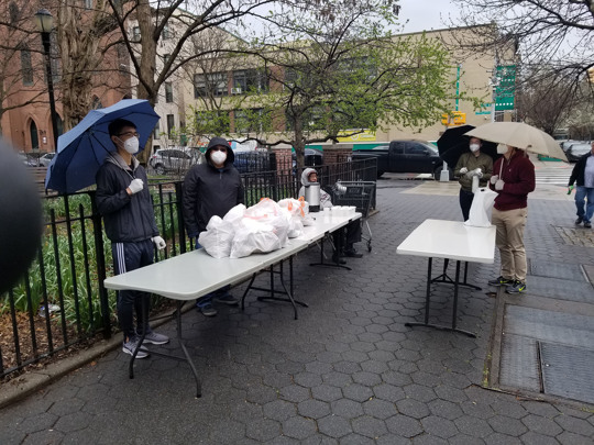Volunteers with Graffiti Church in New York City hand out meals to people in need i