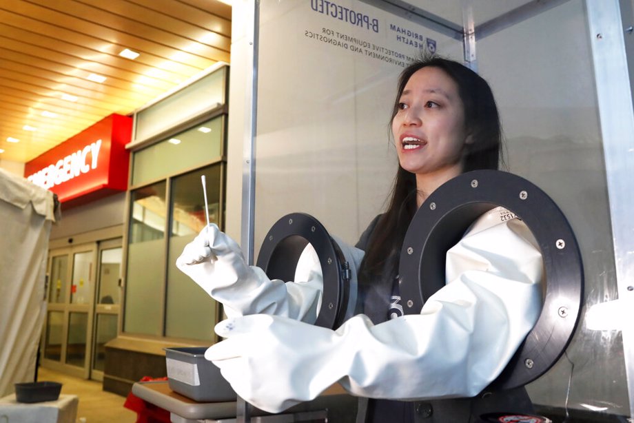 Dr. Sherry Yu demonstrates a free-standing booth for COVID-19 testing