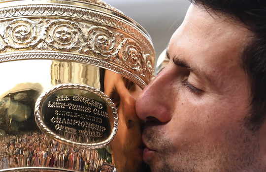 Serbia's Novak Djokovic kisses Wimbledon trophy