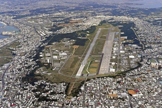 This Jan. 27, 2018, aerial file photo shows U.S. Marine Air Station Futenma in Ginowan, Okinawa, southern Japan. Okinawan officials said Saturday, July 11, 2020 that dozens of U.S. Marines have been confirmed to have infected with the coronavirus at two bases, Futenma and Camp Hansen, on the southern Japanese island in what is feared to be a massive outbreak, and demanded adequate explanation from the U.S. military officials.
