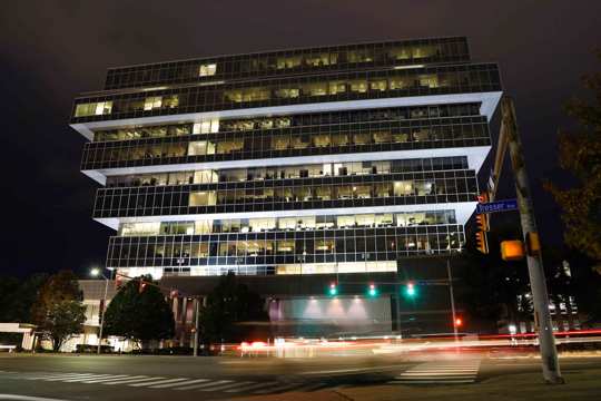 cars pass Purdue Pharma headquarters at night in Stamford, Conn.