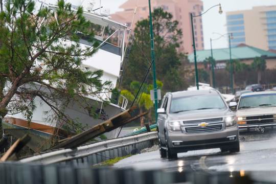 a boat washed up near the road after Hurricane Sally