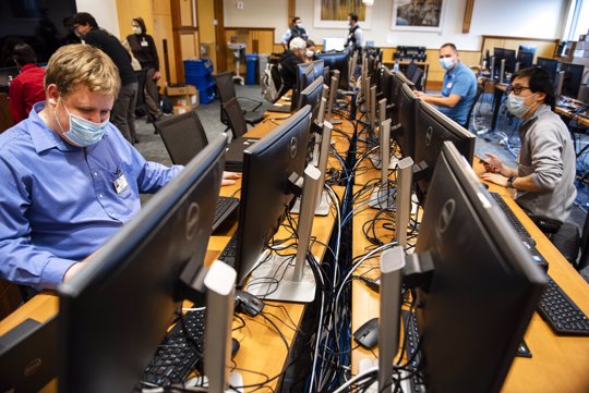Workers scanning code in hospital's network