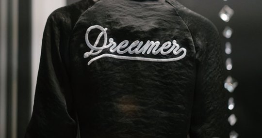 Black jacket with "Dreamer" Stitched into material