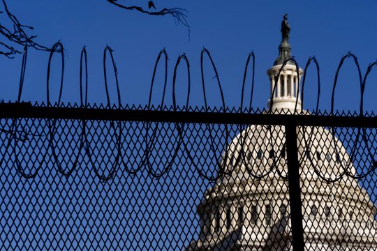 Capitol Building with razor wire fence