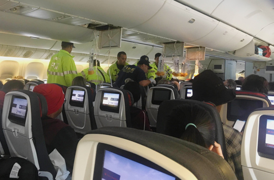 emergency personnel on plane