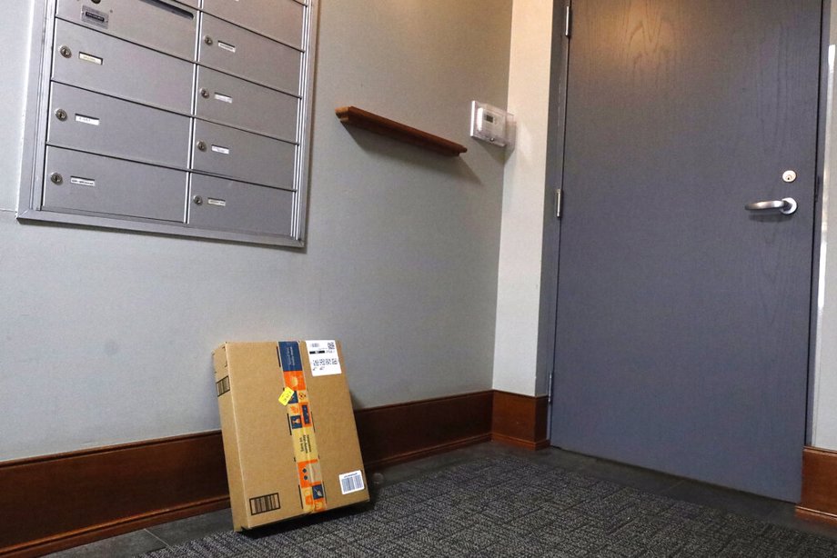 An Amazon package sits by the mailbox at Jason Goldberg's apartment
