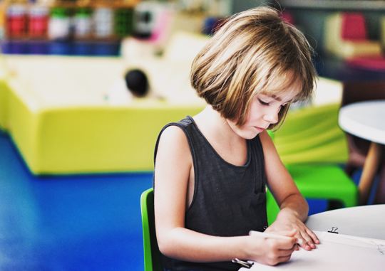 girl writing in book