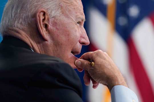 President Joe Biden listens during a virtual meeting with FEMA Administrator Deanne Criswell and governors and mayors of areas impacted by Hurricane Ida, in the South Court Auditorium on the White House campus, Monday, Aug. 30, 2021, in Washington.