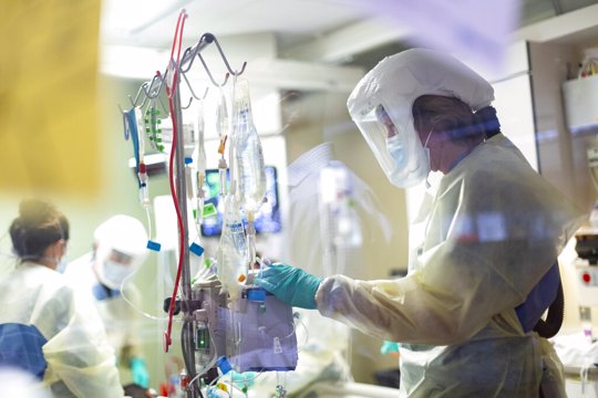 In this Aug. 31, 2021, file photo, Jack Kingsley R.N. attends to a COVID-19 patient in the Medical Intensive care unit (MICU) at St. Luke's Boise Medical Center in Boise, Idaho. Idaho public health leaders have activated "crisis standards of care" for the state's northern hospitals because there are more coronavirus patients than the institutions can handle. The Idaho Department of Health and Welfare made the announcement Tuesday, Sept. 7.