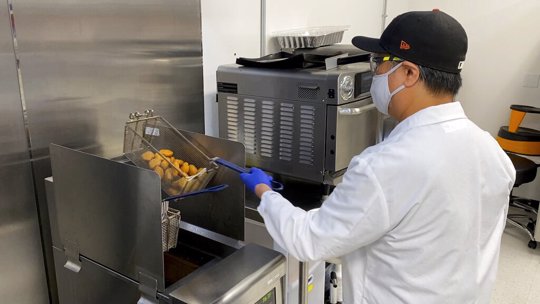 meatless nuggets out of a deep fryer