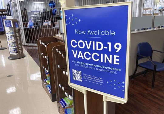 COVID-19 vaccinations are available at a pharmacy in a grocery store in Monument, Colo.