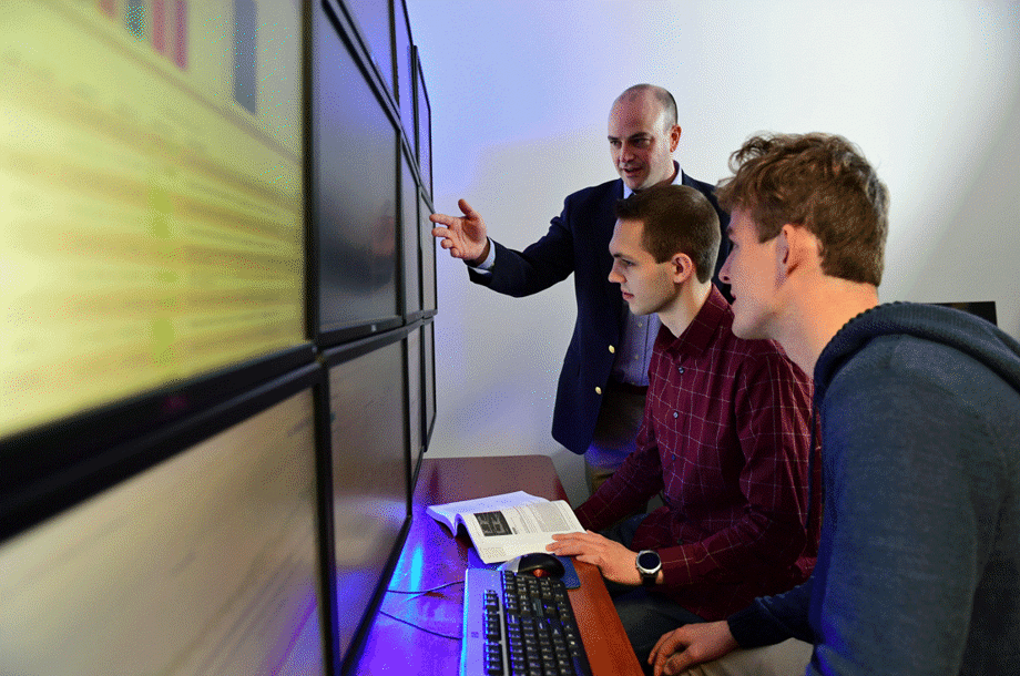 Dr. Seth Hamman and students from Cedarville University's cyber security program