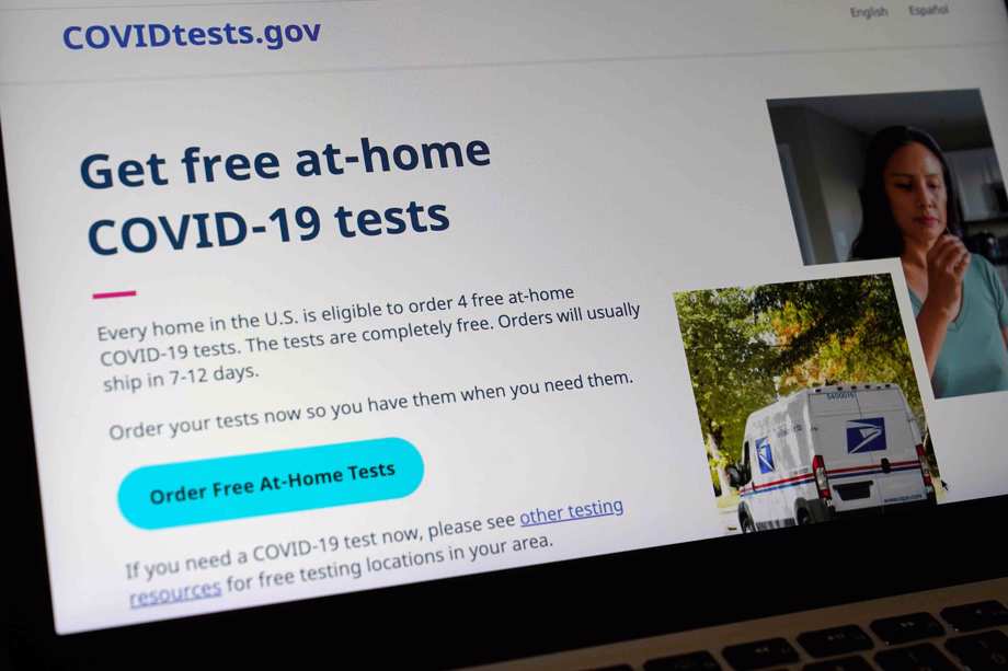 A United States government website is displayed on a computer, Wednesday, Jan. 19, 2022, in Walpole, Mass., that features a page where people can order free, at-home COVID-19 tests.