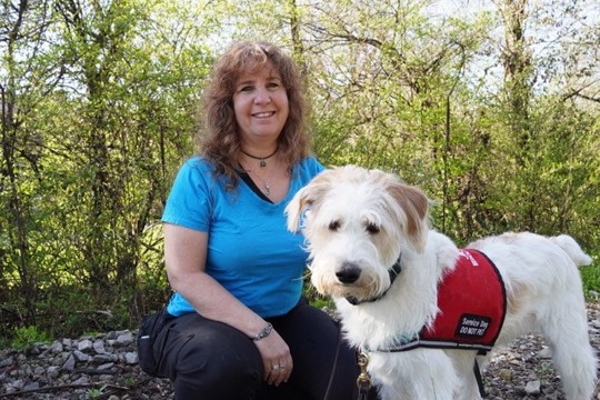Jennifer Cattet with Oscar, a service dog in training