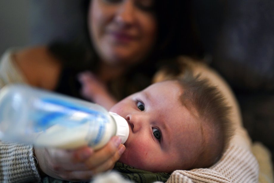 Ashley Maddox feeds her 5-month-old son, Cole, with formula she bought through a Facebook group of mothers in need
