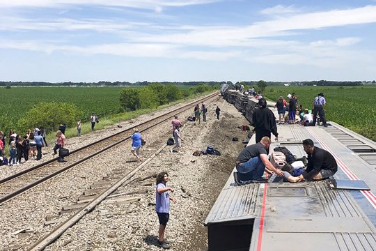 Amtrak passenger train lies on its side after derailing near Mendon, Mo.