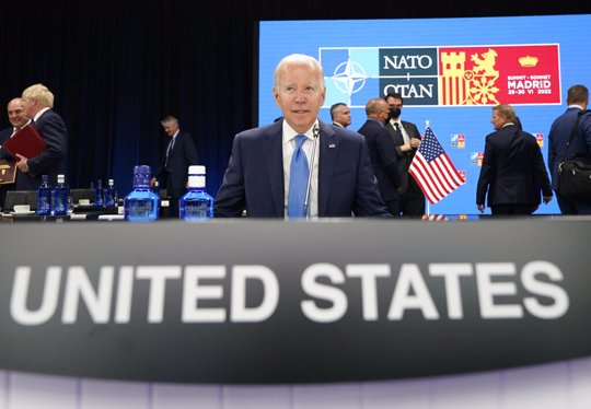 President Joe Biden waits for the start of a round table meeting at a NATO summit in Madrid, Spain