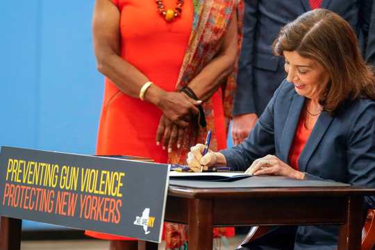 New York Gov. Kathy Hochul signs a package of bills to strengthen gun laws, June 6, 2022, in New York.