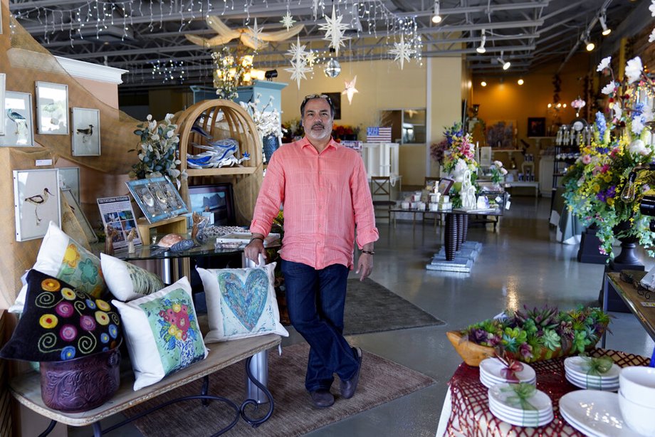 Martin Garcia, owner of gift and décor store Gramercy Gift Gallery, poses for a photo at his shop in San Antonio. 