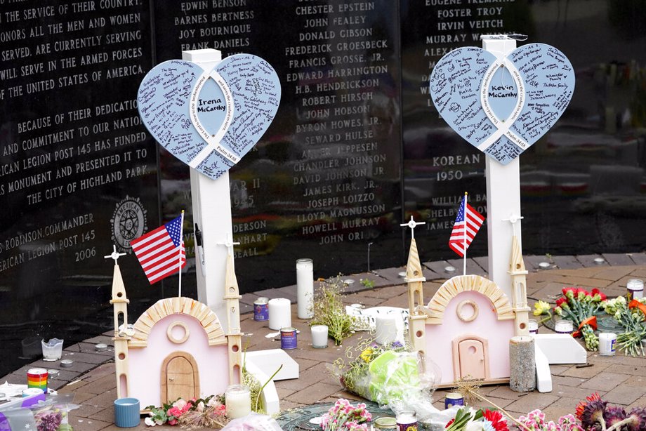 Memorials for Irina and Kevin McCarthy, two of seven people killed in Monday's Fourth of July parade mass shooting, stands within a veterans memorial Wednesday, July 6, 2022, in Highland Park, Ill.
