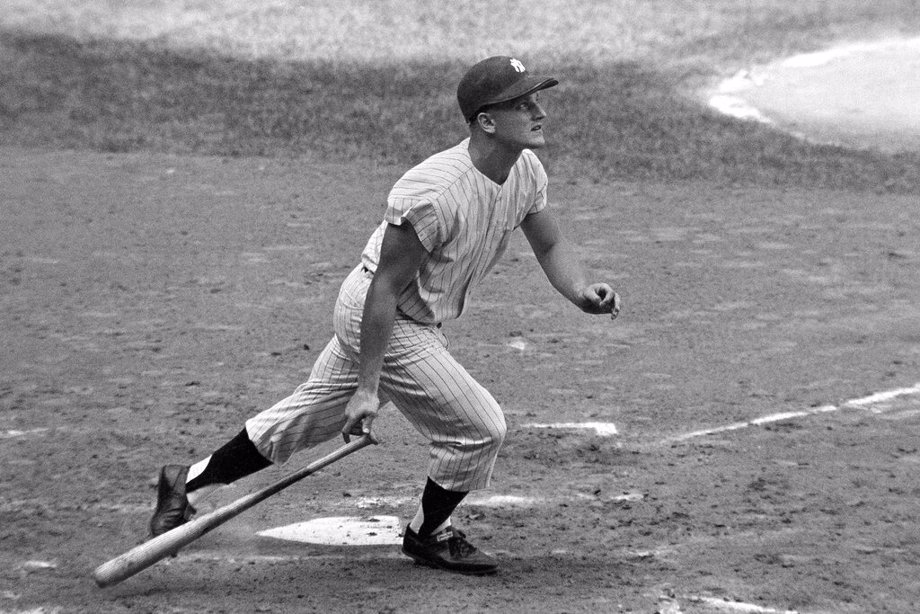 New York Yankees' Roger Maris watches his 61st home run of the season in the fourth inning of a baseball game against the Boston Red Sox in New York, Oct. 1, 1961.