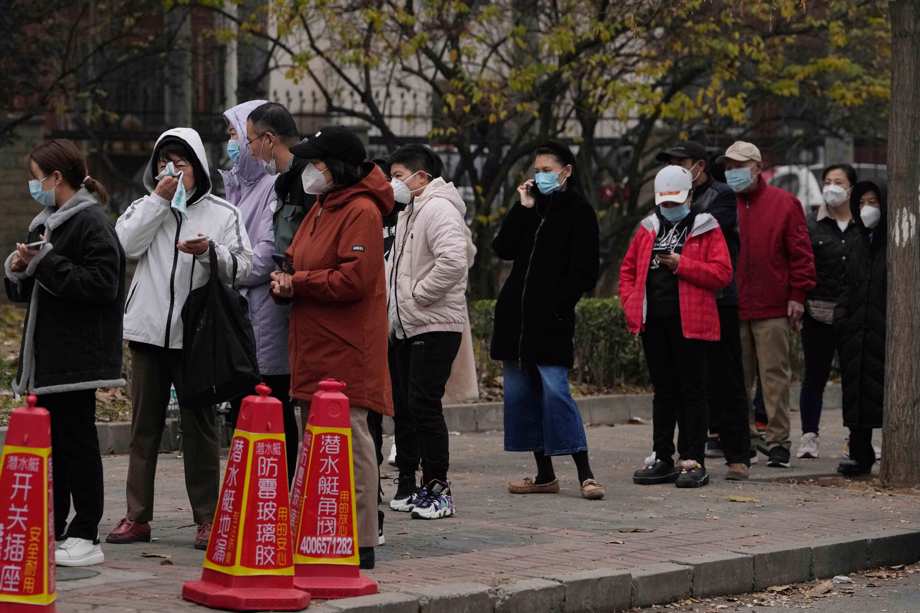 Residents line up for COVID tests in Beijing, Thursday, Nov. 24, 2022.