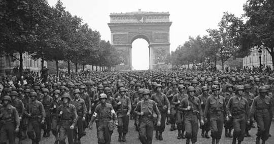 1944 US soldiers march in Paris after liberation of France