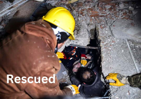 Emergency workers and medics rescue a woman out of the debris of a collapsed building in Elbistan, Kahramanmaras, in southern Turkey