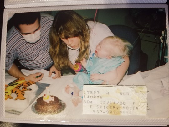 Lauryn Gibson as baby with parents