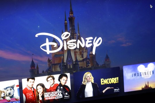 Disney logo forms part of a menu for the Disney Plus movie and entertainment streaming service on a computer screen