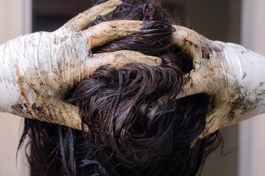 woman dyes hair