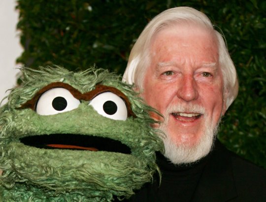 Caroll Spinney, right, who portrays "Sesame Street" characters Oscar The Grouch, left, and Big Bird, arrives for the Daytime Emmy nominee party at the Hollywood Roosevelt Hotel in Los Angeles. Spinney, who gave Big Bird his warmth and Oscar the Grouch his growl for nearly 50 years on "Sesame Street," died Sunday, Dec. 8, 2019, at the age of 85 at his home in Connecticut, according to the Sesame Workshop.