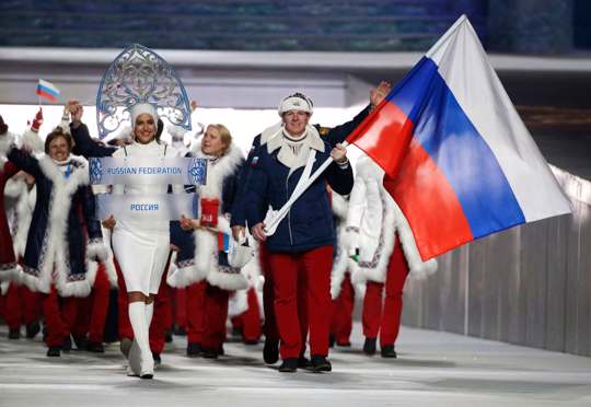 Russian athletes holding Russian flag