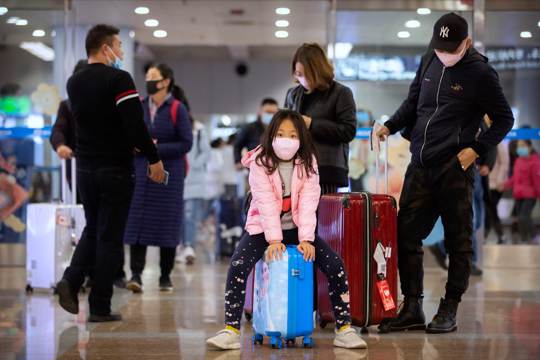 Travelers wear face masks at airport in China