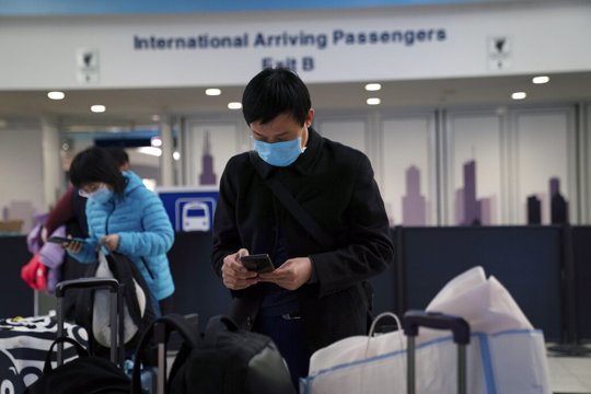 Passengers from United flight UA850 direct from Beijing arrive at Terminal 5 at O'Hare International Airport, Friday, Jan. 24, 2020 in Chicago. A Chicago woman has become the second U.S. patient diagnosed with the dangerous new virus from China, health officials announced Friday.
