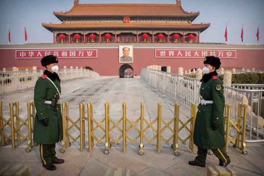 Paramilitary police stand guard at Tiananmen Gate