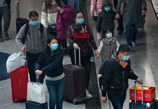 Travelers at Hong Kong Airport