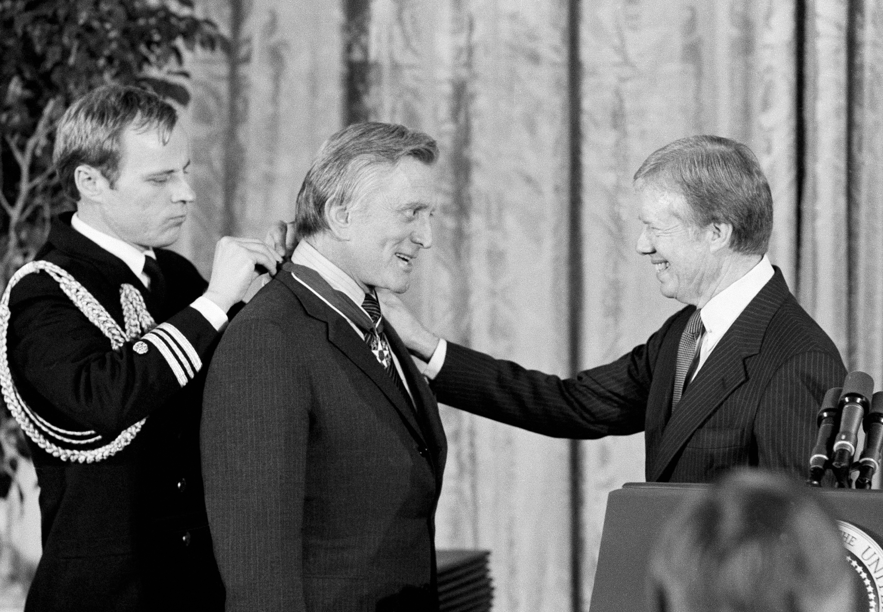 President Jimmy Carter congratulates actor Kirk Douglas upon receiving the Medal of Freedom