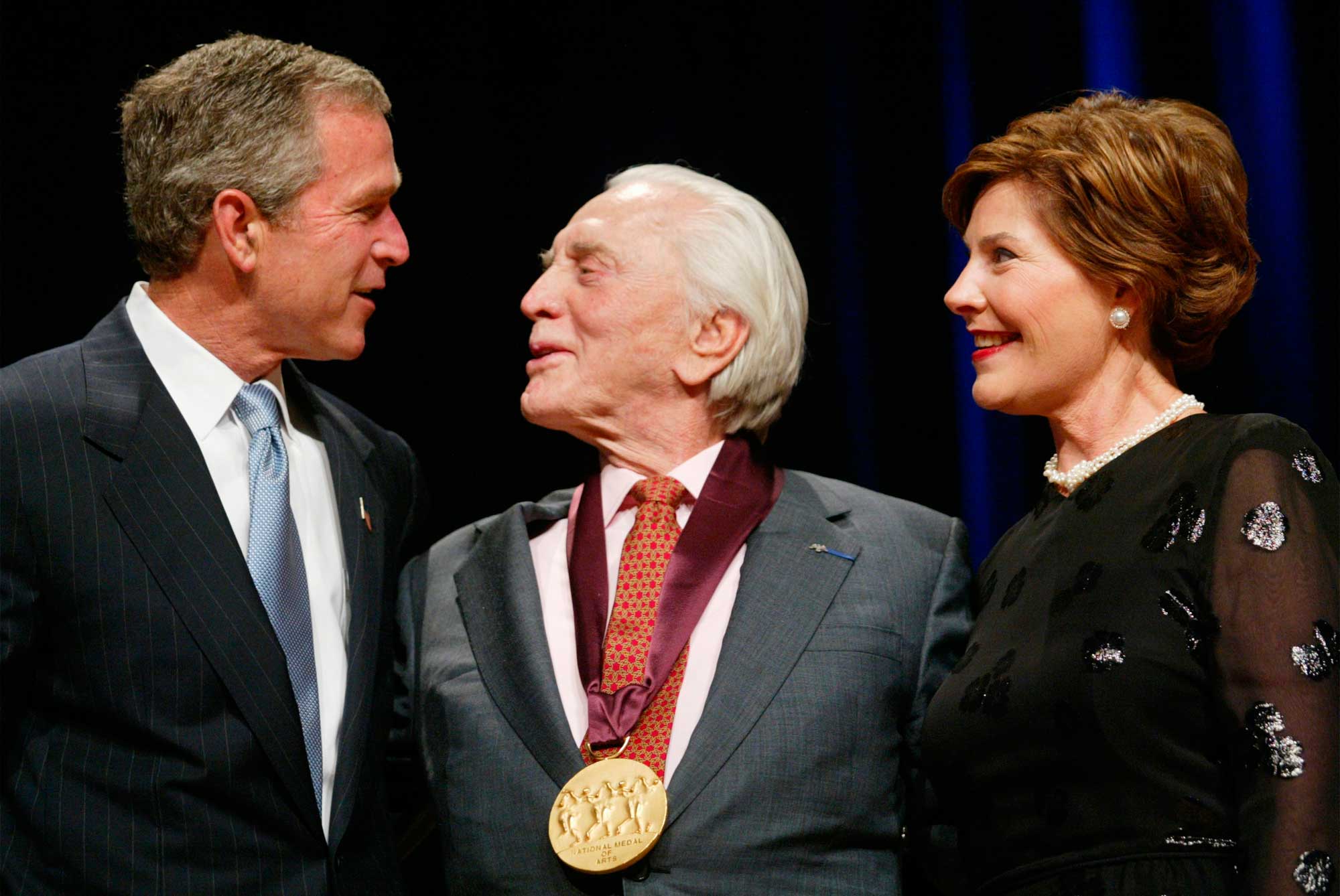 President George W. Bush and first lady Laura Bush with actor Kirk Douglas