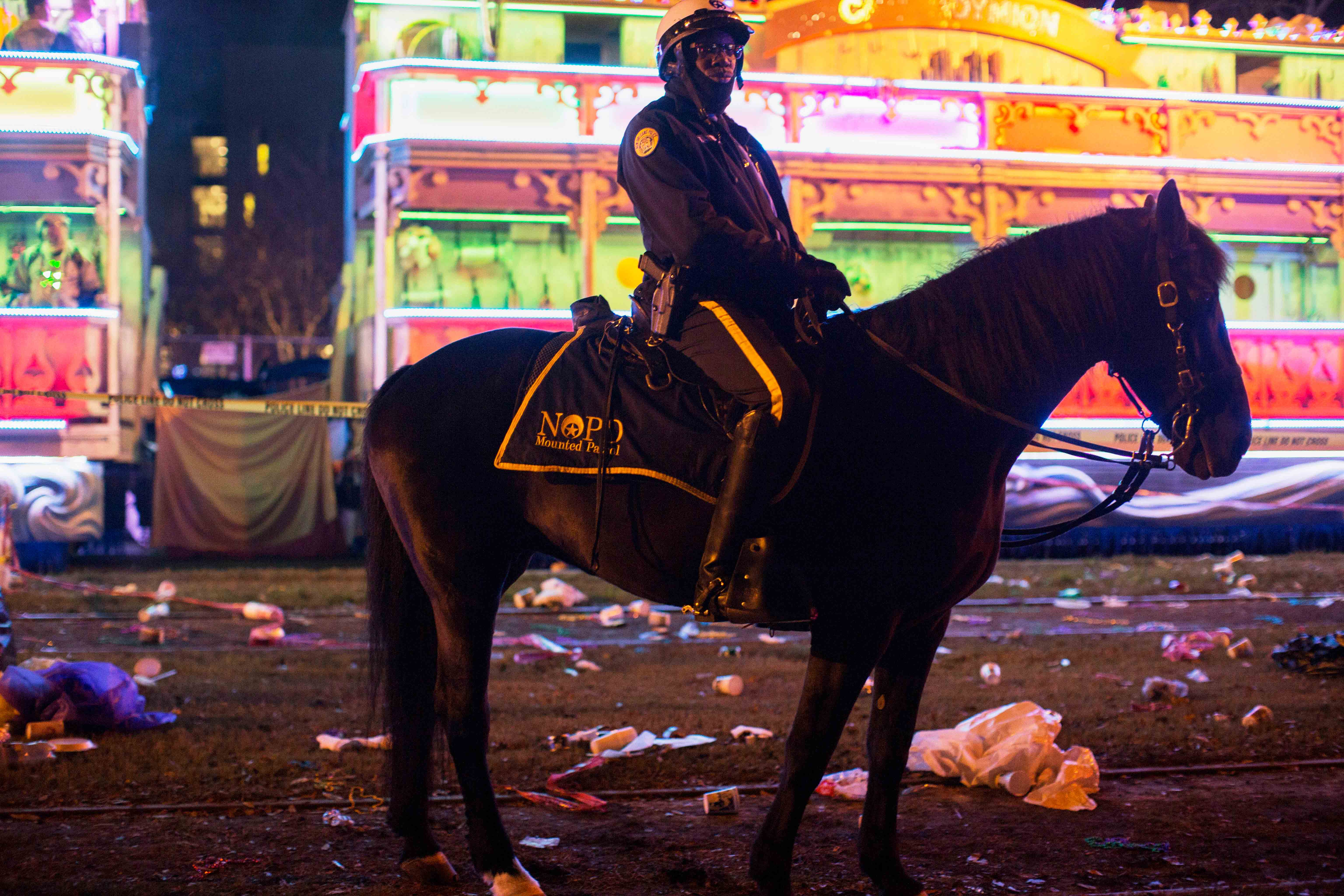 A police officer works the scene where a man was reportedly hit and killed by a float of the Krewe of Endymion parade in the runup to Mardi Gras in New Orleans, Saturday, Feb. 22, 2020.